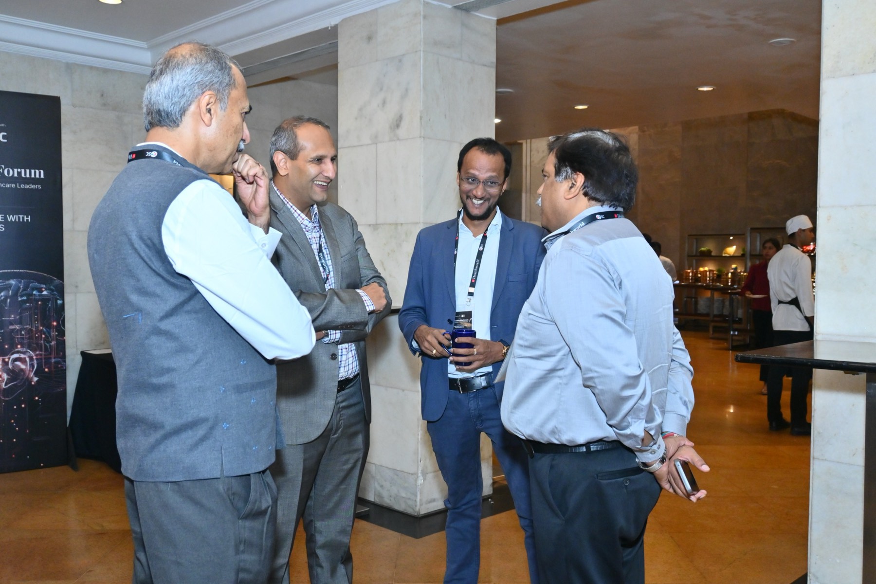 Hospital leaders in conversation on arrival.