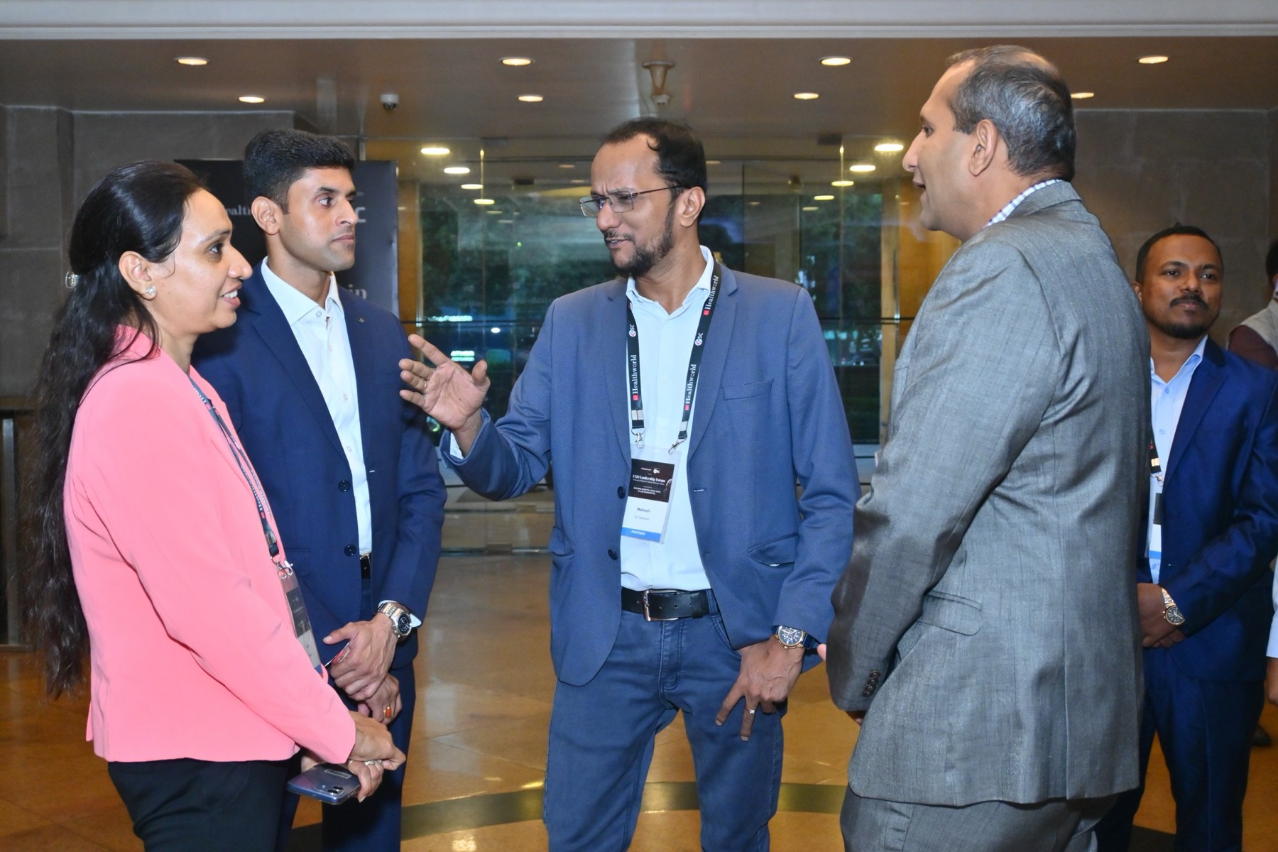A small group of attendees in conversation.
