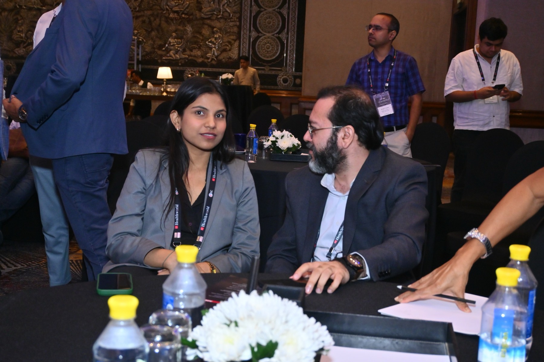 Attendees talking between sessions.