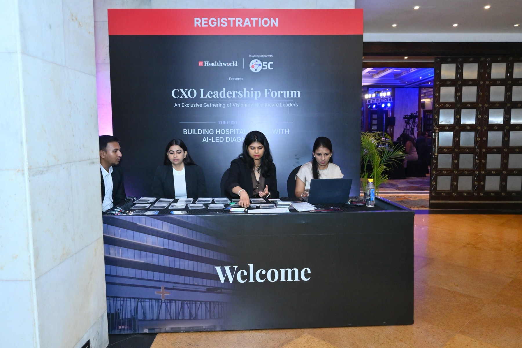 The CXO Leadership Forum registration desk with the forum theme on the backdrop.
