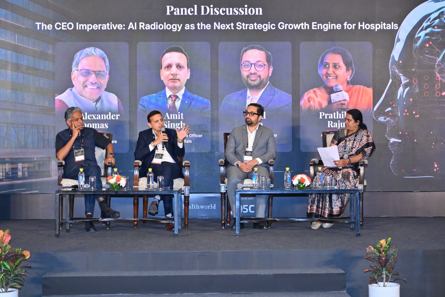The CEO panel seated on stage under the title The CEO Imperative.